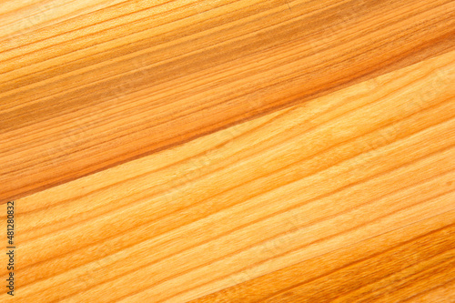 background and texture of smooth treated wood close-up diagonally.