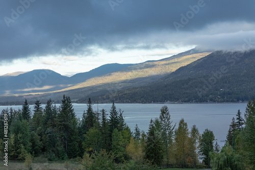 Beautiful landscape of mountains and lake in overcast day.