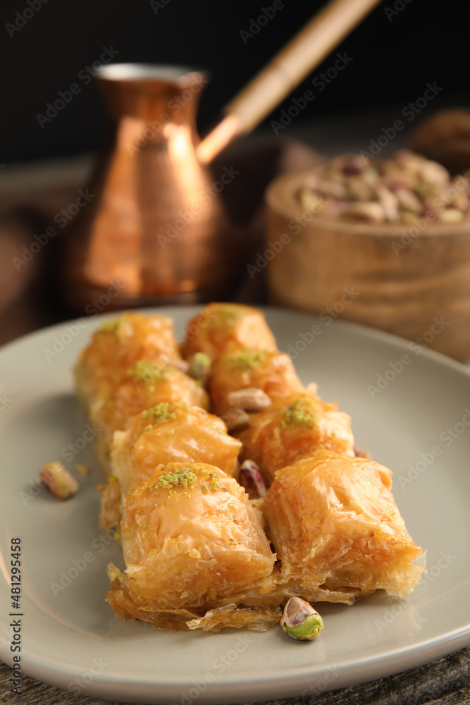 Delicious baklava with pistachio nuts on table, closeup Delicious baklava with pistachio nuts on table, closeup