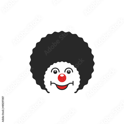 Portrait of a cheerful pendant logo, head of a circus comedian with a smile in a curly wig and a round red nose.
