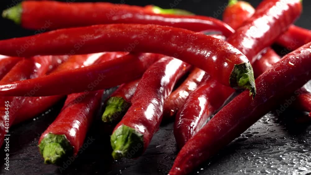 Clean red chilly pepper rotation background. Close up. Clean red chilly pepper rotation background. Close up.