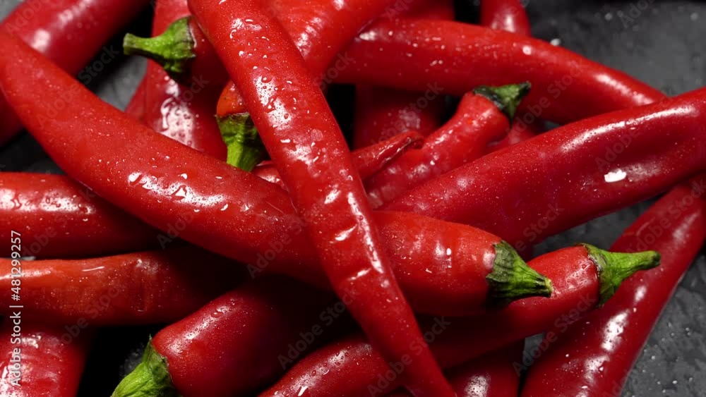 Clean red chilly pepper rotation background. Close up. Clean red chilly pepper rotation background. Close up.