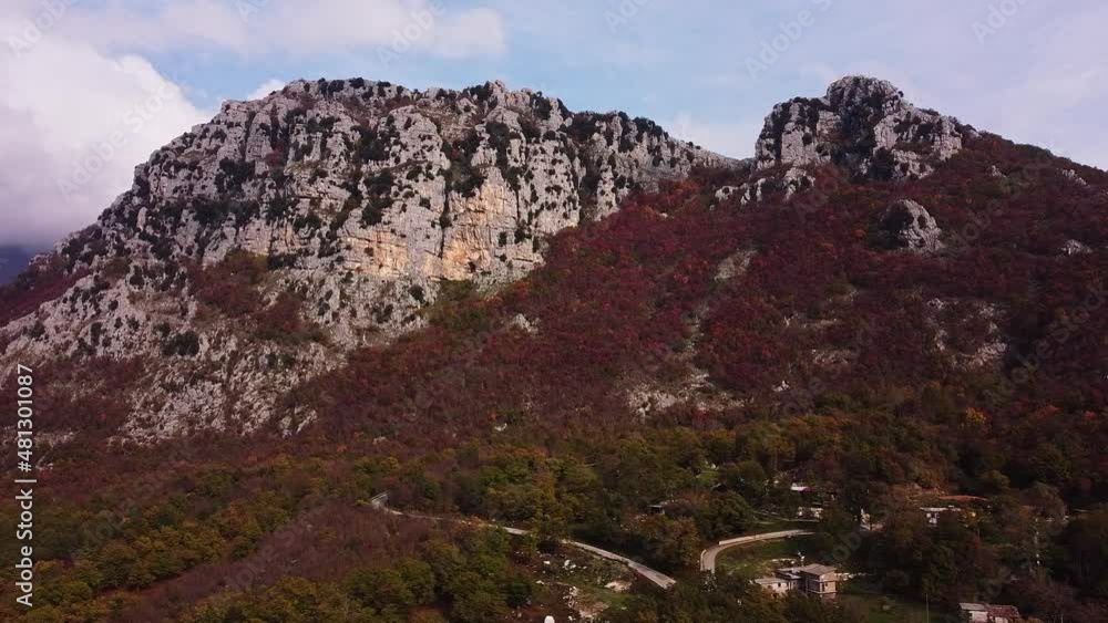 Aerial panning view of red vegetation at the foot of the mountain of Pietraroja. Italy Aerial panning view of red vegetation at the foot of the mountain of Pietraroja. Italy