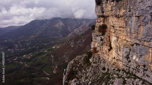 Forward aerial view of part of the mountain rock in a close-up. Pietraroja valley. Italy photo