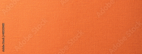 布地風の質感のあるコーラルオレンジの紙の背景テクスチャー