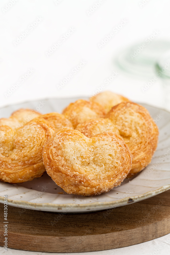 Delicious Palmier butterfly pastry in heart shape for Valentine's day dessert. Delicious Palmier butterfly pastry in heart shape for Valentine's day dessert.