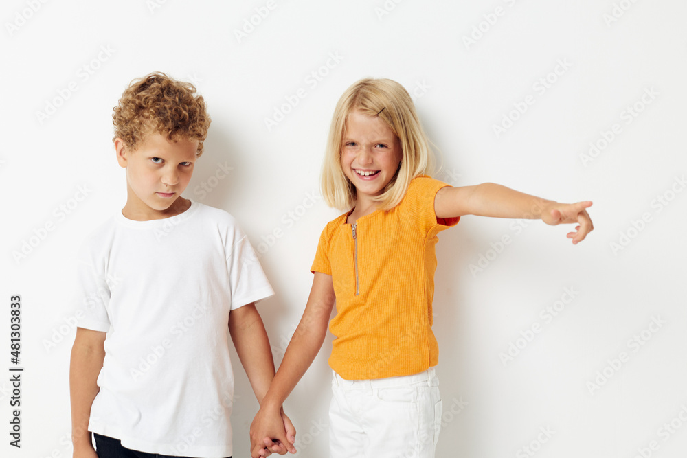 Cute preschool kids Friendship together posing emotions light background hold hands Cute preschool kids Friendship together posing emotions light background hold hands