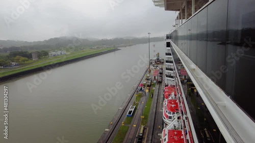 Cruise ship on Panama Canal transit navigating across locks of waterway photo