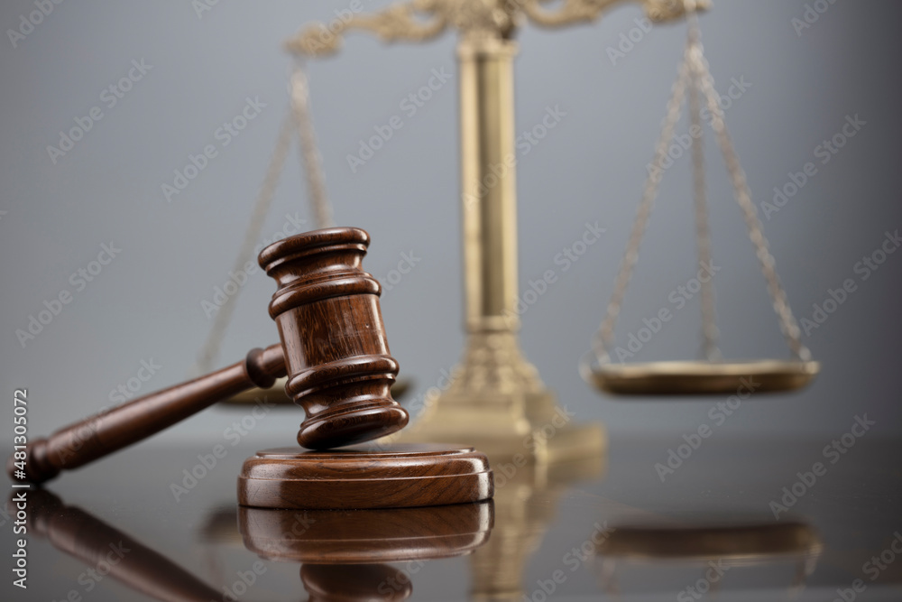 Law symbols composition. Law and justice concept. Gavel and scale on gray background. Law symbols composition. Law and justice concept. Gavel and scale on gray background.