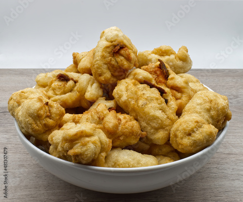 Traditional Italian Crispeddi Calabresi. Fried salted donuts with pieces of anchovies inside. Crispeddi are prepared especially in south Italy during the Christmas time. photo