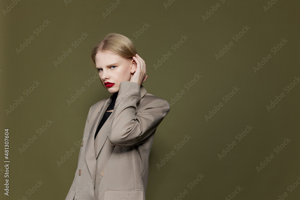 glamorous woman with red lips holds hand near face studio model unaltered glamorous woman with red lips holds hand near face studio model unaltered