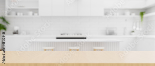 Wooden kitchen countertop with copy space over white kitchen background. photo