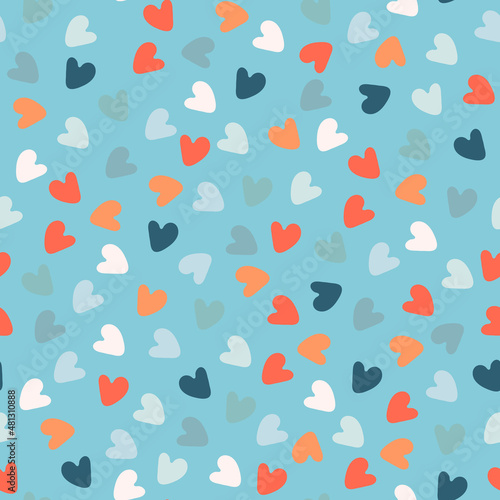 Seamless pattern with hand drawn multicolored heart shapes on blue background, for wrapping paper and other design projects. Valentines Day concept, love, LGBT, romance concept