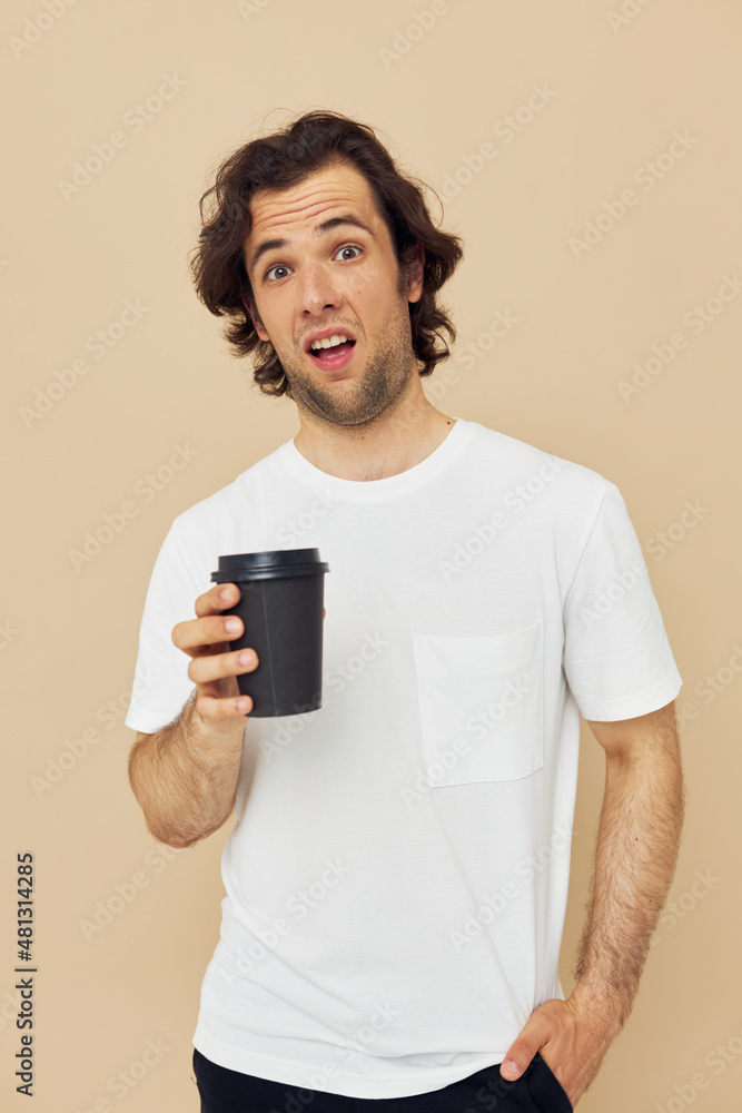 handsome man with a black glass in a white t-shirt isolated background handsome man with a black glass in a white t-shirt isolated background