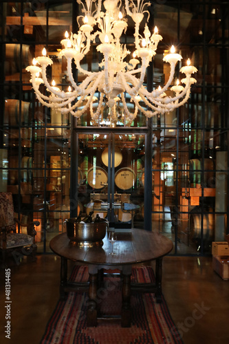 Wine cellar under a large chandelier