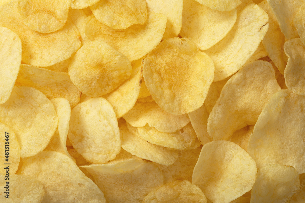 Full frame foodbackground of potato chips, top view Full frame foodbackground of potato chips, top view