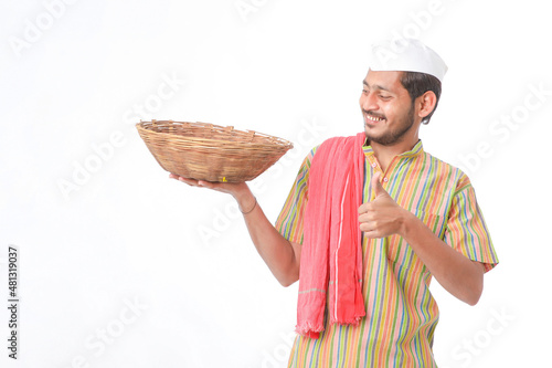 Indian man holding wooden bowl in hand on white background. photo