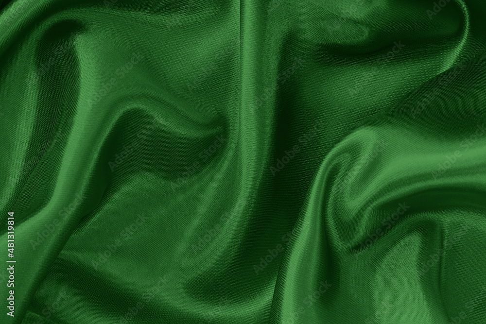 Fototapeta premium Dark green fabric cloth texture for background and design art work, beautiful crumpled pattern of silk or linen.
