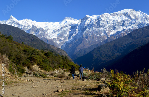 hiker in the mountainsPanoramic view of Mountain Annapurna was seen from Sikles village.