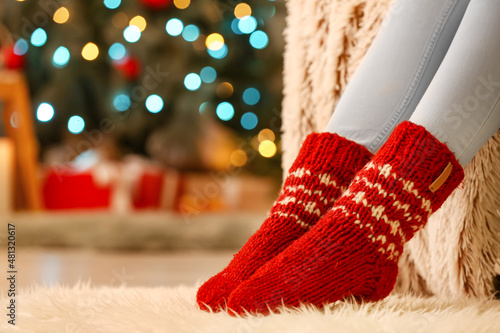 Woman in warm socks at home...