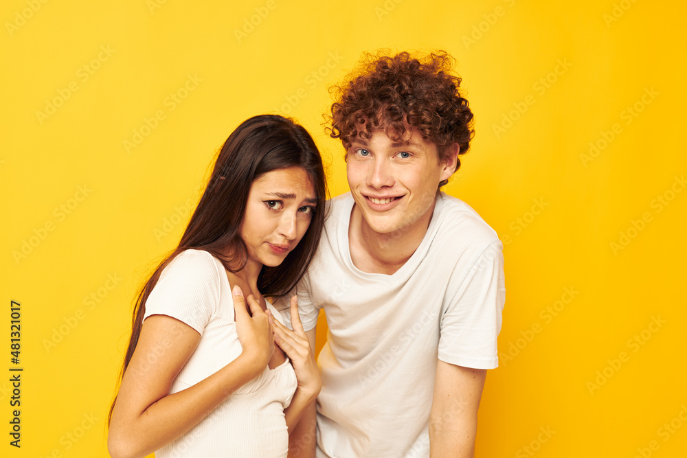 portrait of a man and a woman standing side by side in white t-shirts posing Lifestyle unaltered portrait of a man and a woman standing side by side in white t-shirts posing Lifestyle unaltered