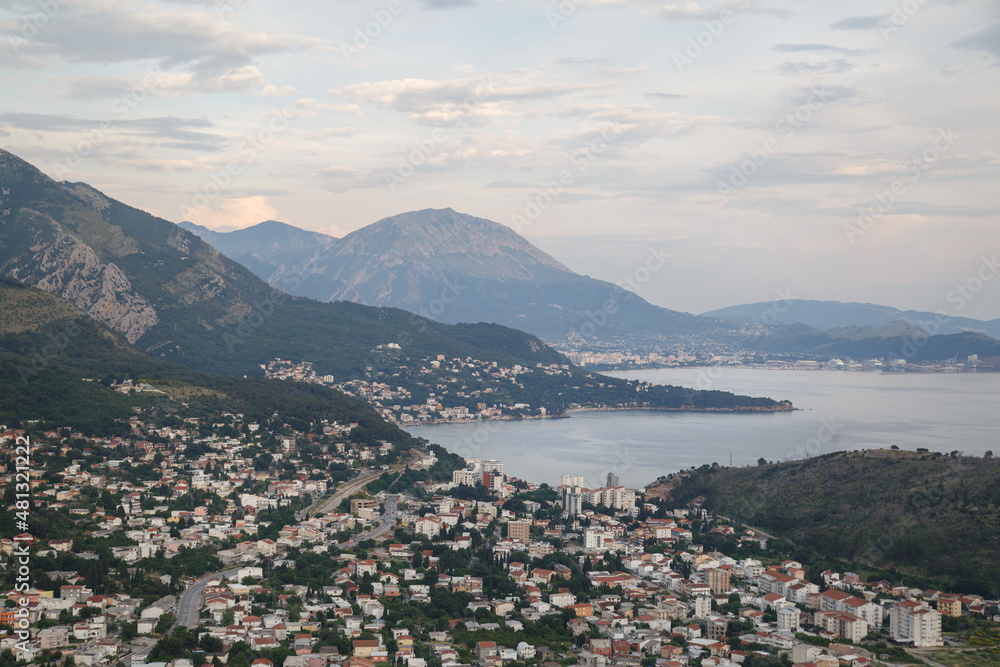 Landscape with the seaside town of Sutomore Montenegro in the valley among the mountains.