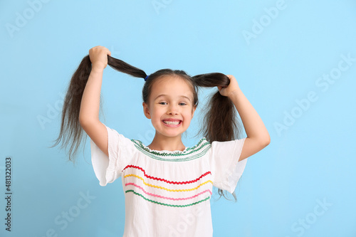 Portrait of happy little gi...