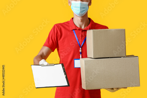 Male courier in medical mas...