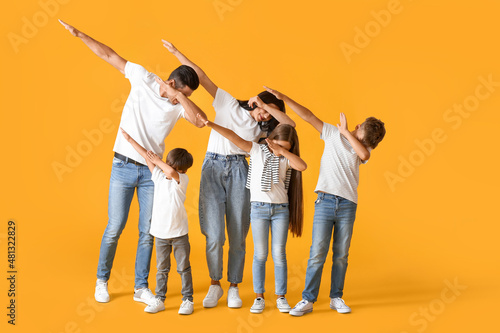 Happy dancing family on col...