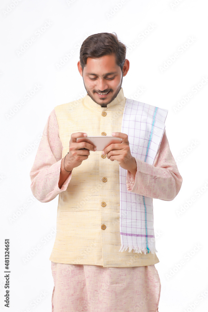 Young indian farmer using smartphone on white background. Young indian farmer using smartphone on white background.