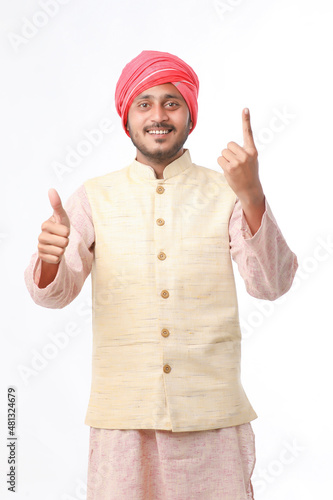Young Indian man showing finger after voting. voting sign in india.