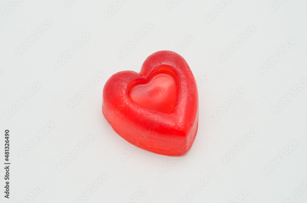 handmade soap in the shape of a heart. Gift for valentine's day on a white isolated background. handmade soap in the shape of a heart. Gift for valentine's day on a white isolated background.