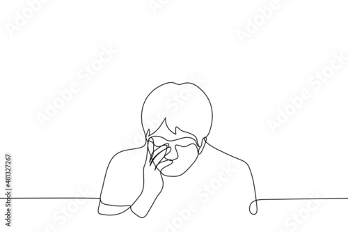 Obraz na plátně man bowed head and grabbed face with hand - one line drawing vector