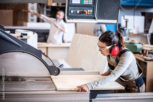 Fotografie male and female carpenter at work, man and woman are crafting with wood in a wor