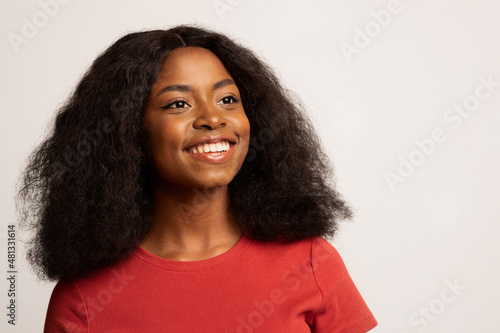 Beautiful Dreamy Young African American Woman Smiling And Looking Away