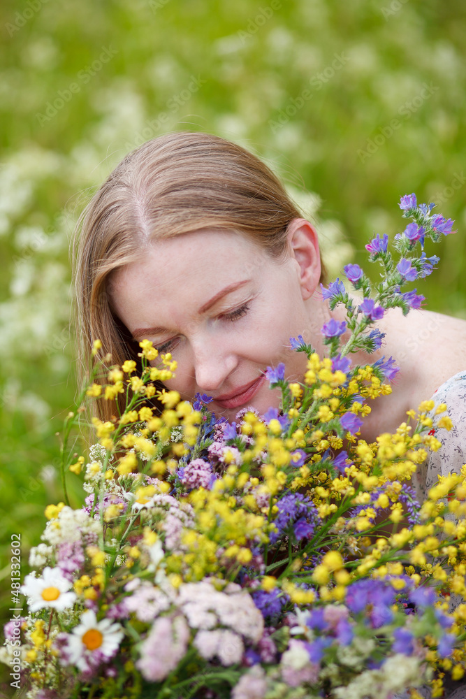 Medieval lady in historical dress. Aroma of spring nature, wild flowers, blue sky, sunshine. Medieval lady in historical dress. Aroma of spring nature, wild flowers, blue sky, sunshine.