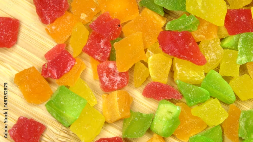 Colorful candied fruits, rotation background. Close up. Loop motion Colorful candied fruits, rotation background. Close up. Loop motion