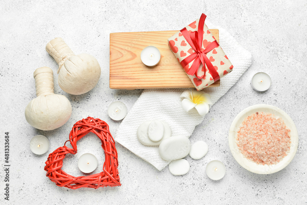 Beautiful spa composition with stones and candles for Valentine's Day celebration on light background Beautiful spa composition with stones and candles for Valentine's Day celebration on light background