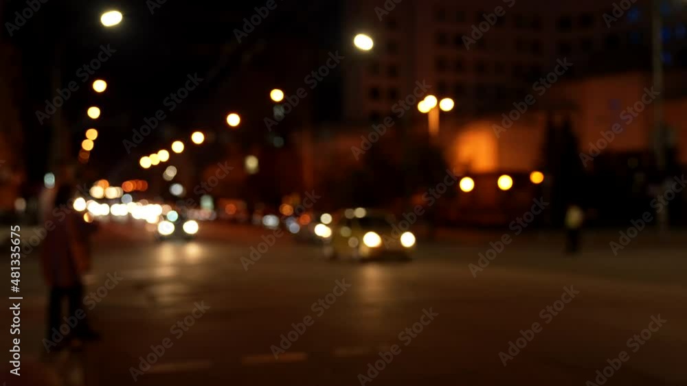 Blurry image of night traffic with blur lights bokeh outdoors, street Blurry image of night traffic with blur lights bokeh outdoors, street