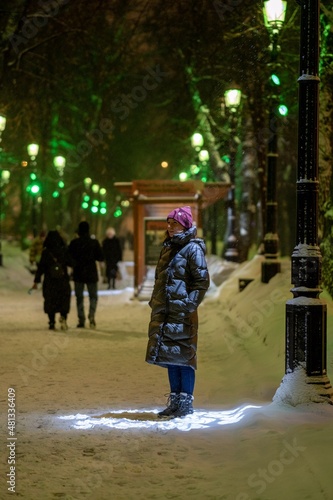 Woman walking in the city park