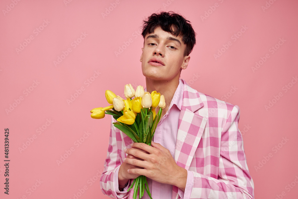 cute guy in a plaid jacket with a bouquet of flowers gift date cute guy in a plaid jacket with a bouquet of flowers gift date