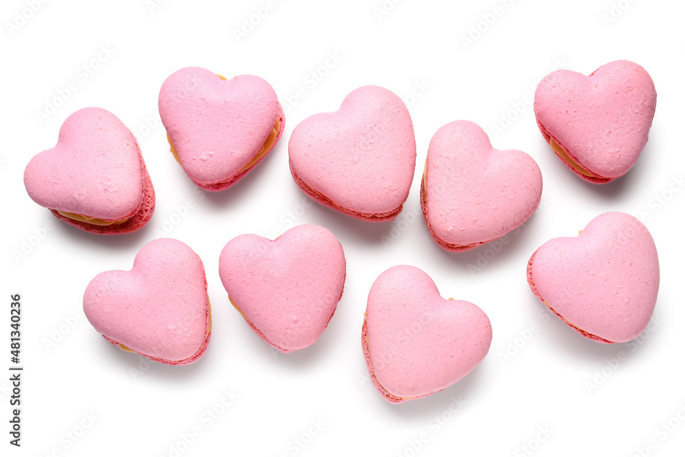 Tasty heart-shaped macaroons on white background Tasty heart-shaped macaroons on white background