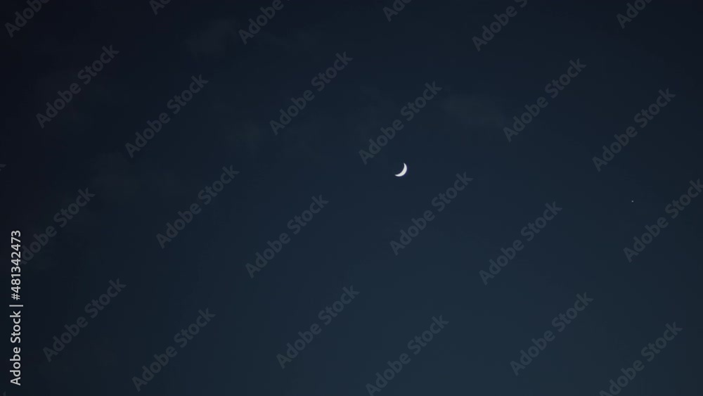 Panning of half moon in the blue sky Panning of half moon in the blue sky