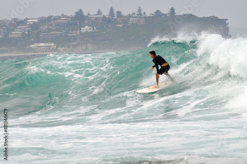 A surfer in action at Fairy Bower in Sydney, Australia