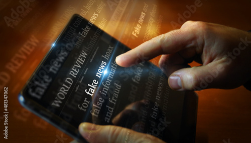 Photography Titles on screen in hand with fake news and hoax information 3d illustration