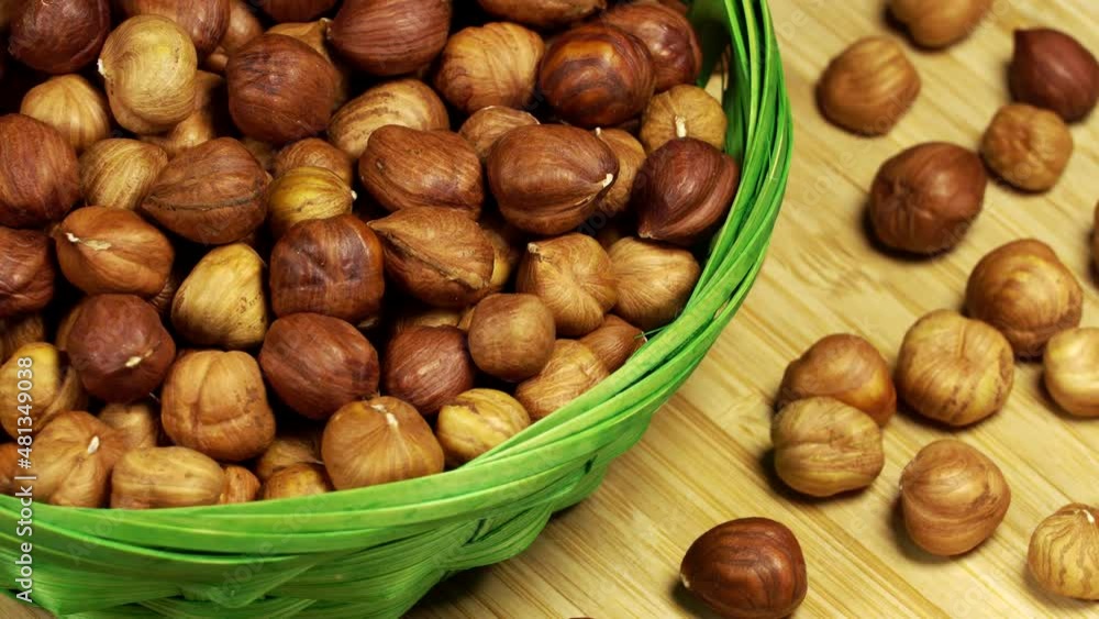 Hazelnuts in a basket, rotation background Hazelnuts in a basket, rotation background
