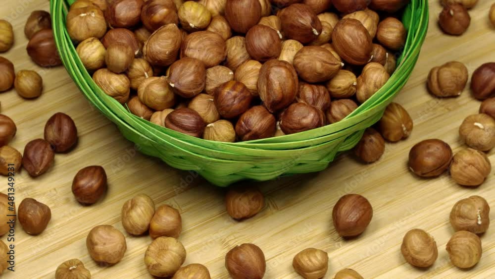 Hazelnuts in a basket, rotation background. Close up Hazelnuts in a basket, rotation background. Close up