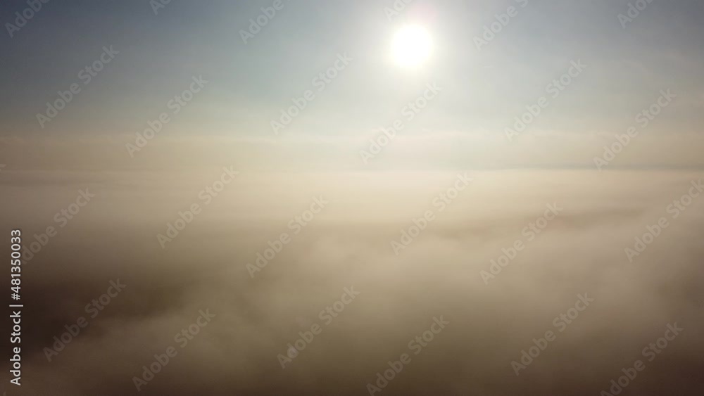 Flying above the clouds and fog from left to right Flying above the clouds and fog from left to right