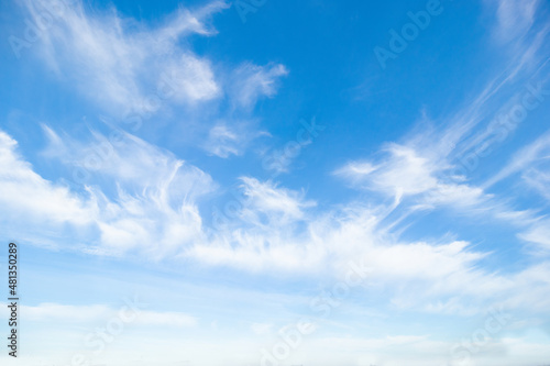 Blue sky with white soft clouds. Summer background. Clearing day and good weather in the morning.