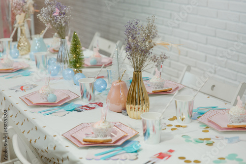 
The festive table is beautifully served to receive guests. An example of decorating a table for a birthday or anniversary celebration. Wedding table. Nutcracker style table